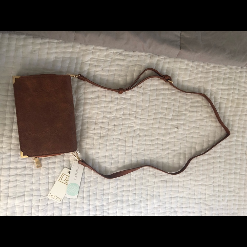 Brand new, tags still on tan clutch/crossbody!